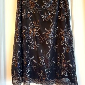 Knee length skirt with scalloped bottom floral embellishment Size 12